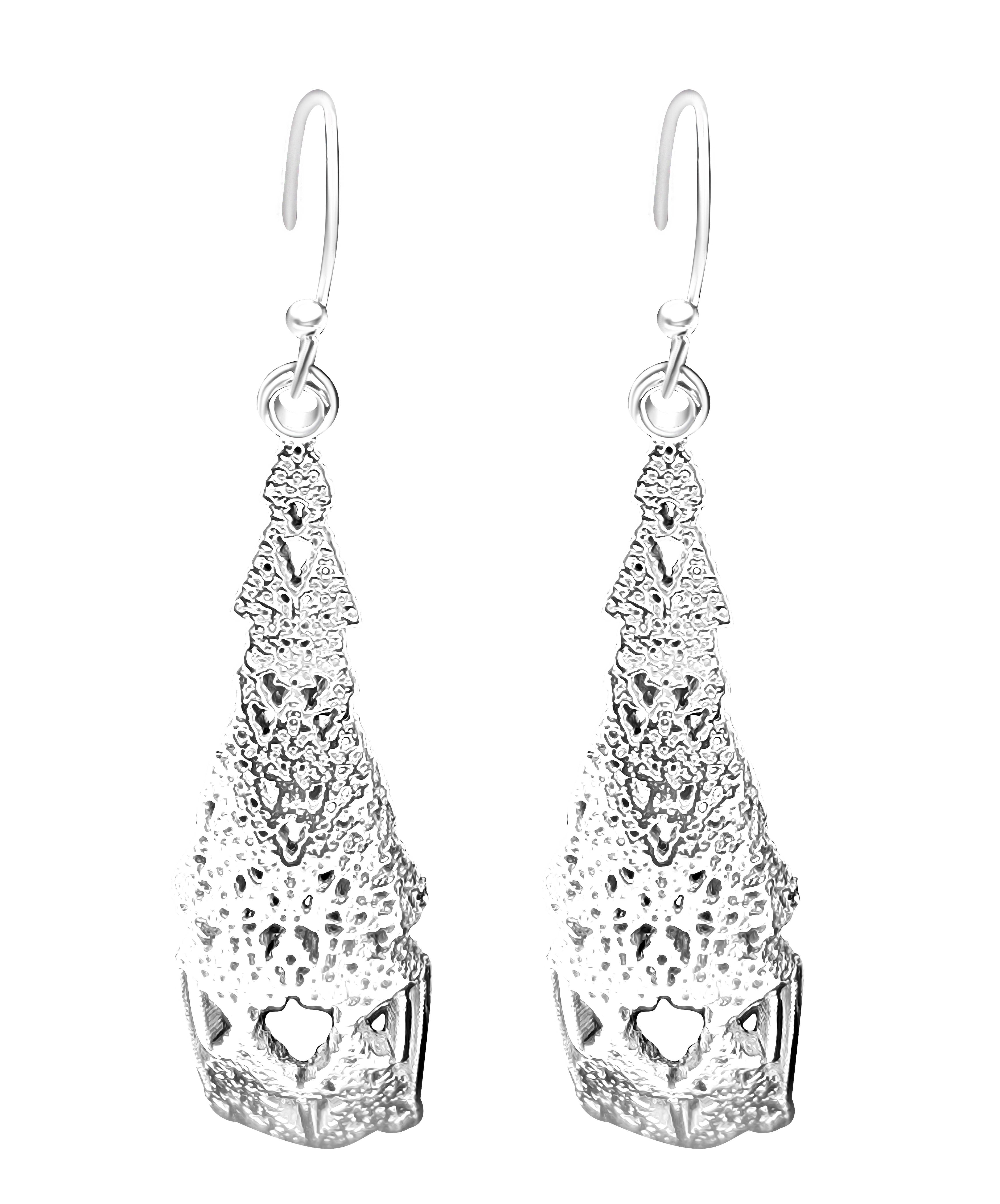 A pair of dangling silver earrings with an intricate organic design, displayed against a light background.