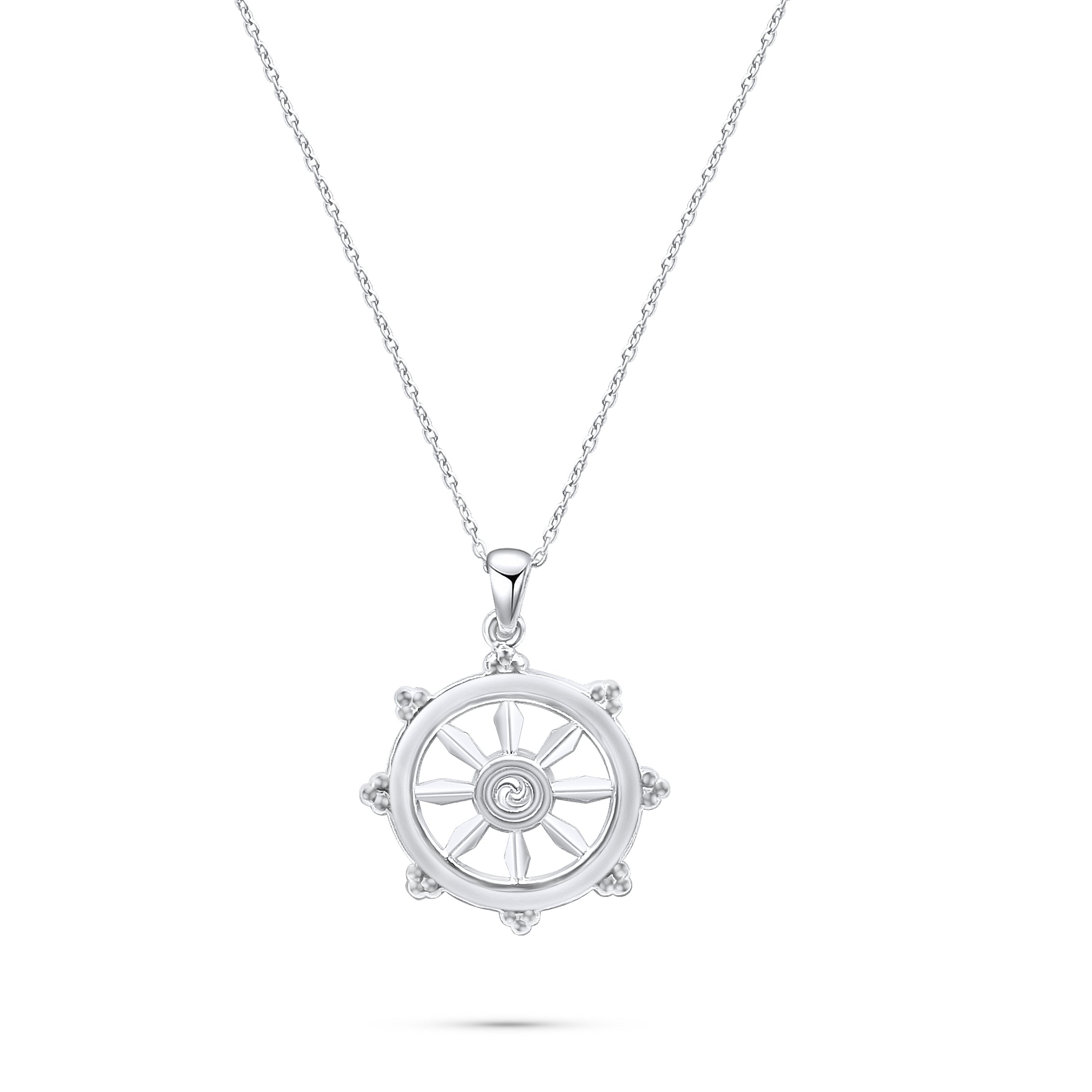 A Dharmachakra (Dharma Wheel) pendant made of silver, suspended from a silver chain in front of a white background