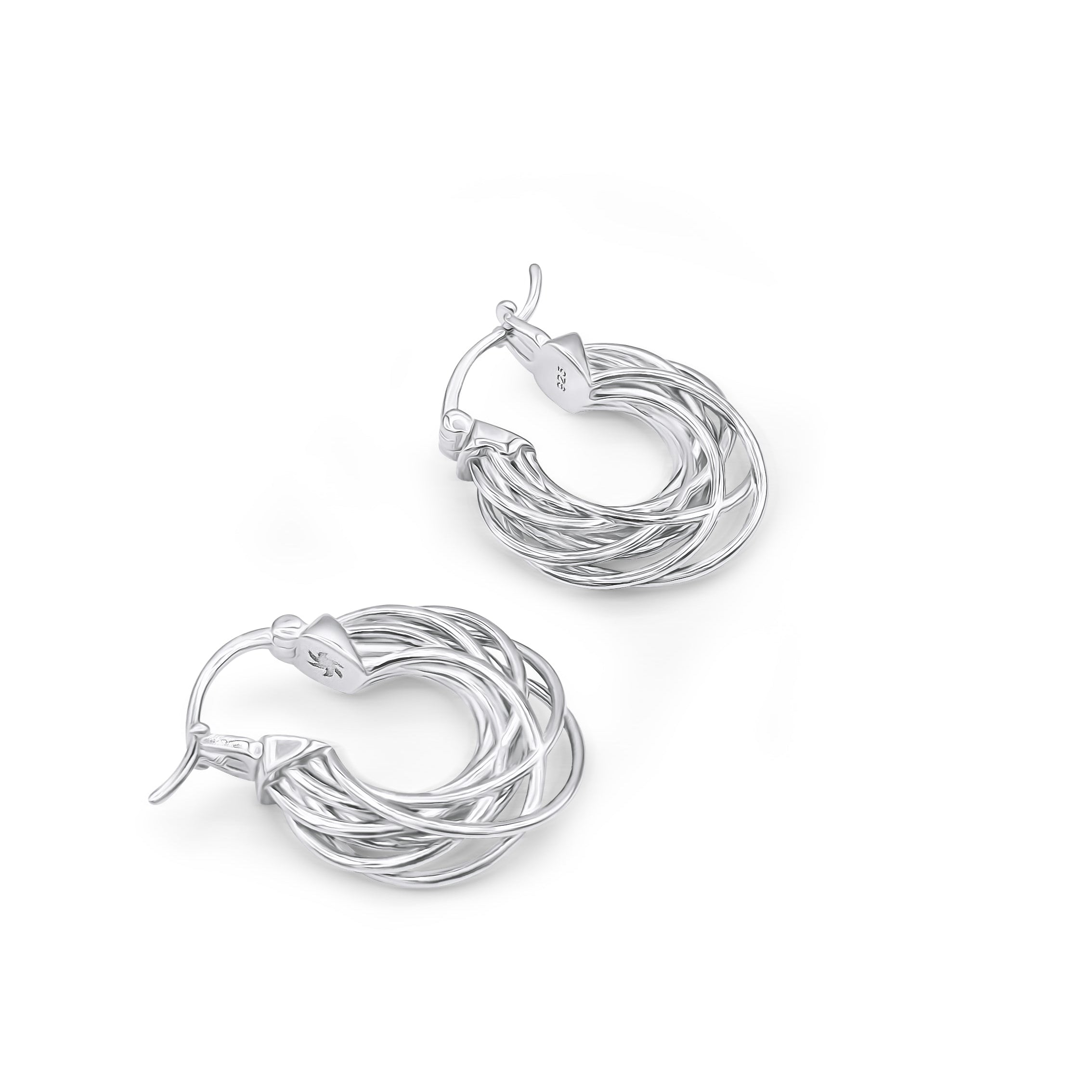 A pair of silver hoop earrings with intricate details, inspired by the movement of satellites in space.