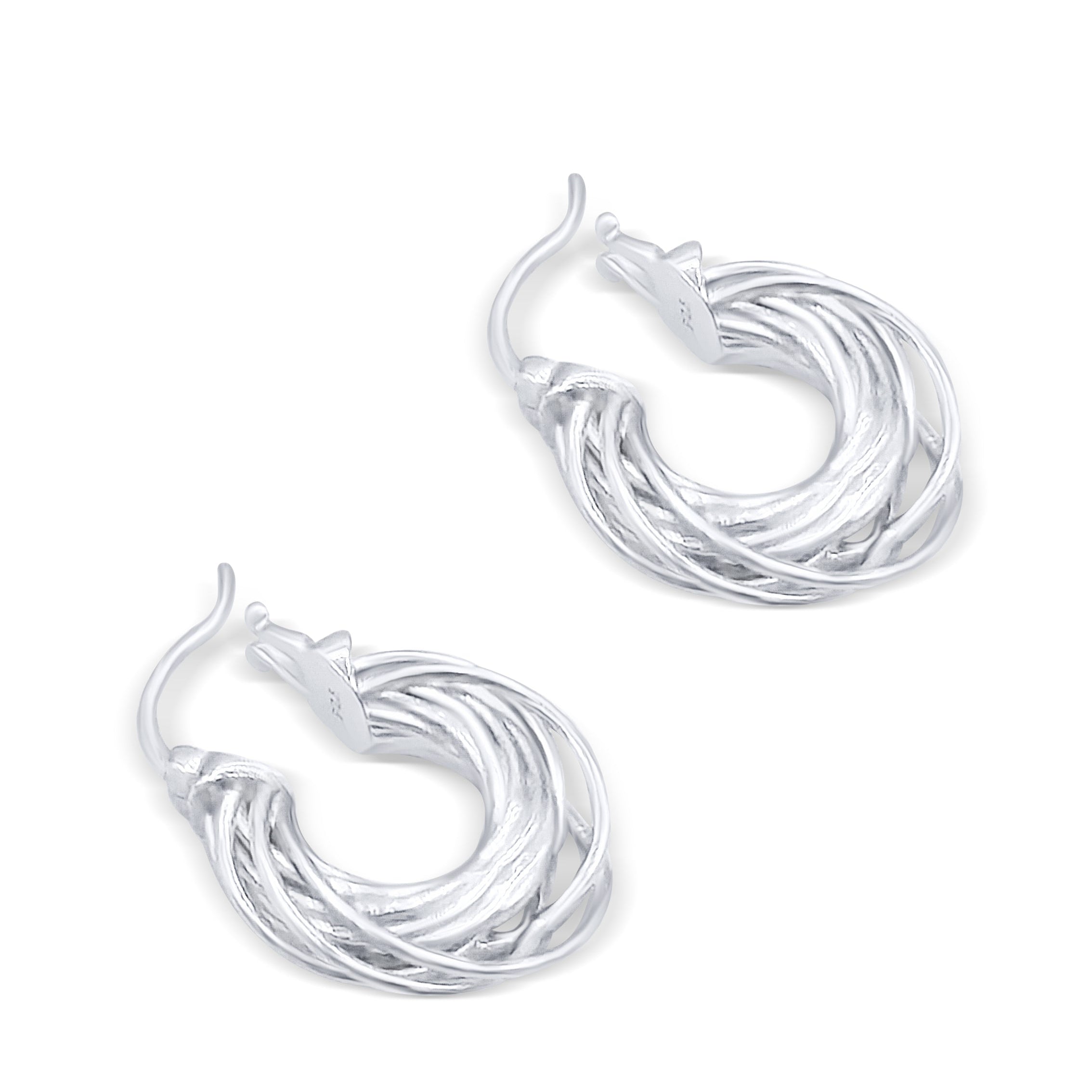 hoop earrings on white surface