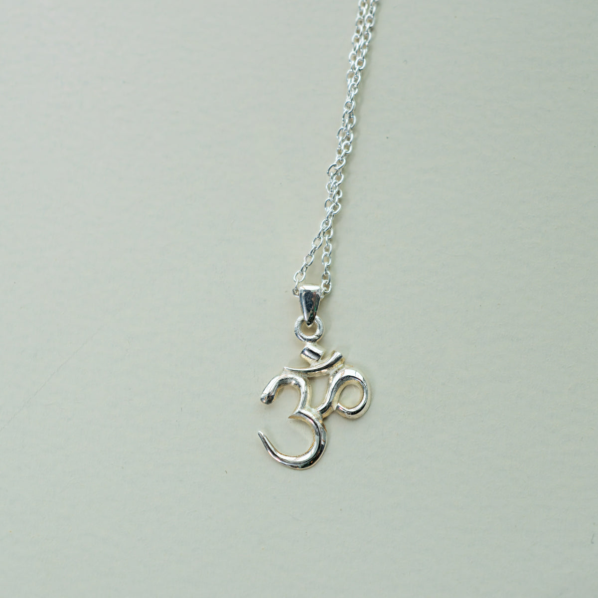 Classic Om Pendant in sterling silver, a spiritual om necklace for yoga and meditation, by Baroque++