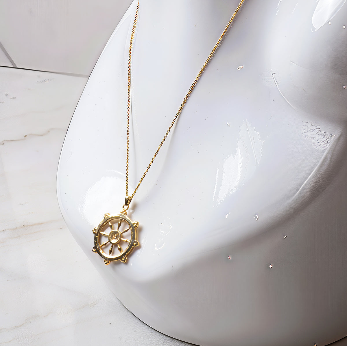Gold Dharmachakra pendant, alternate view
