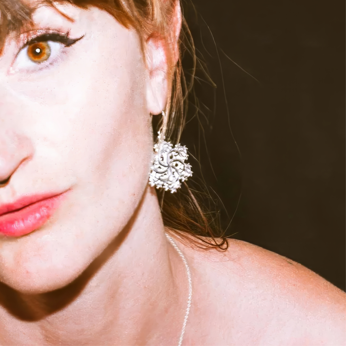 Woman wearing Six-Pointed fractal snowflake earrings