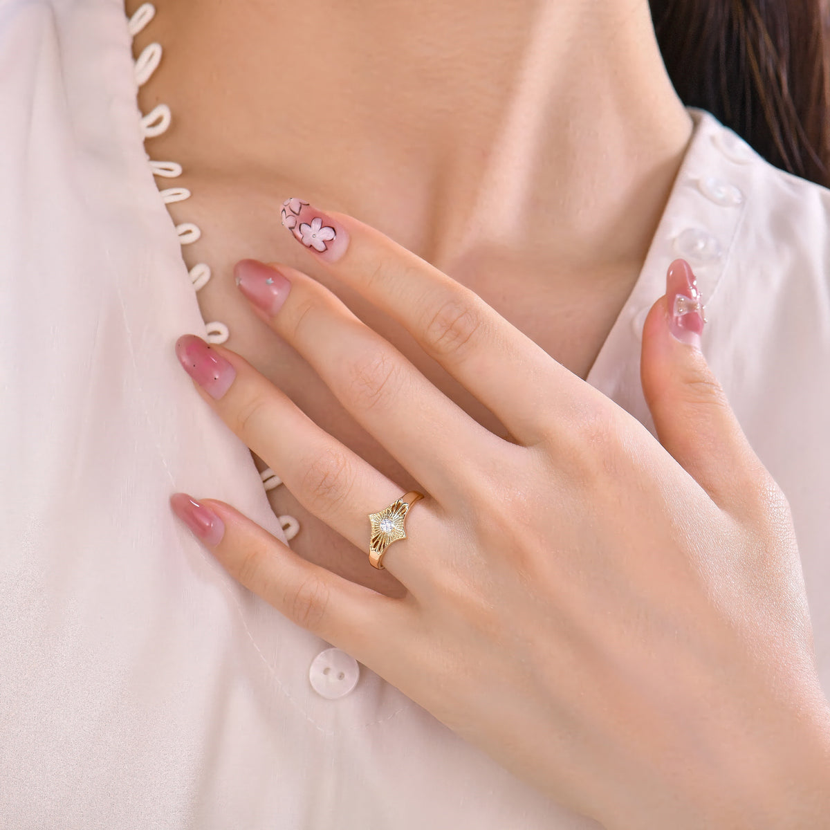 Hand wearing the gold Starburst Diamond Ring