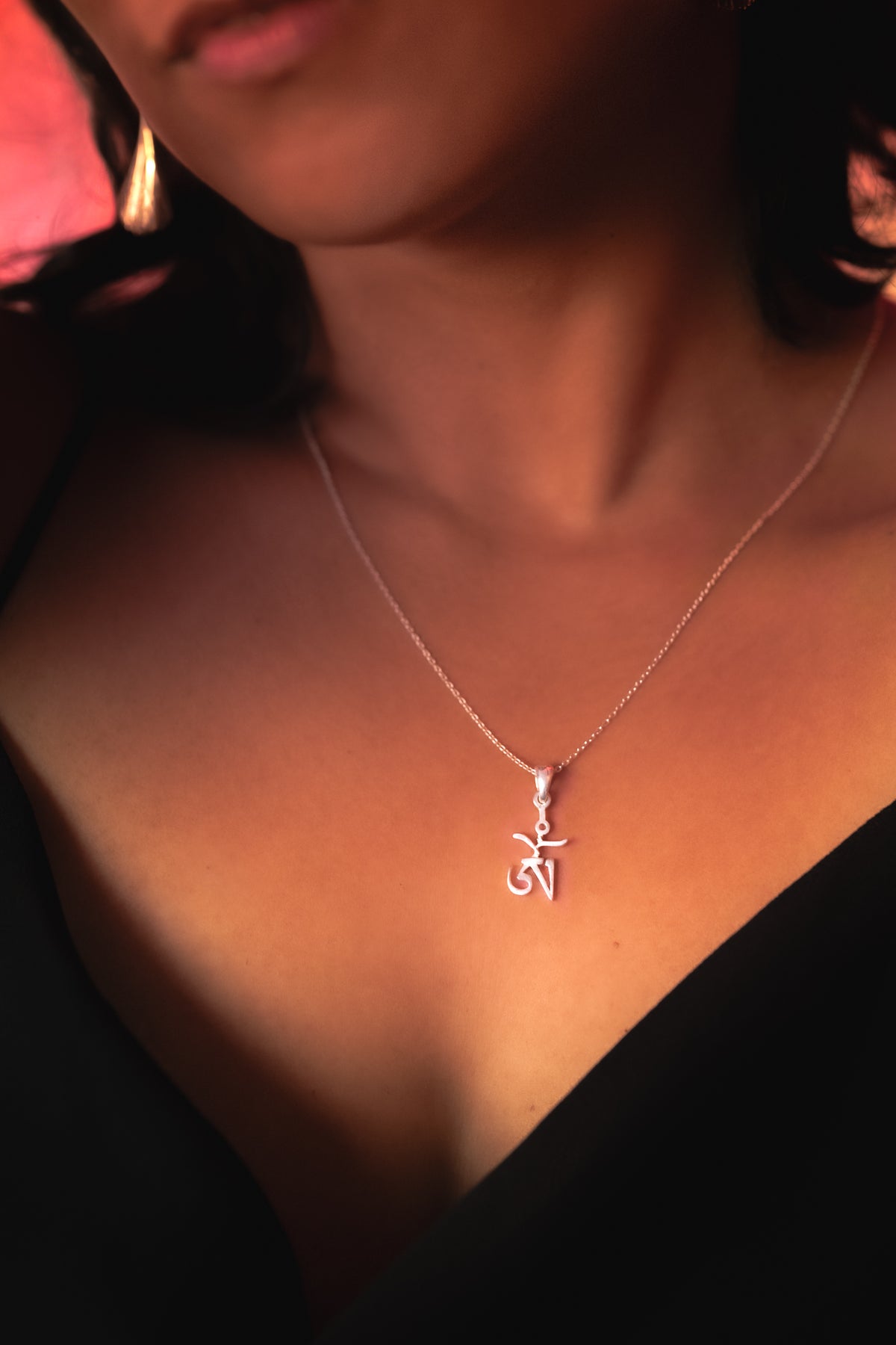 Model wearing the Tibetan Om Pendant