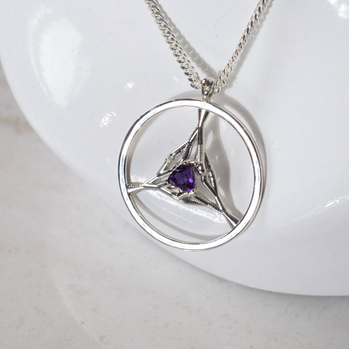 Trillium pendant with a trillion amethyst, a February birthstone necklace