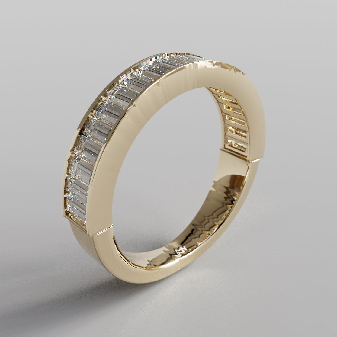 Gold ring with diamond accents on a gray background