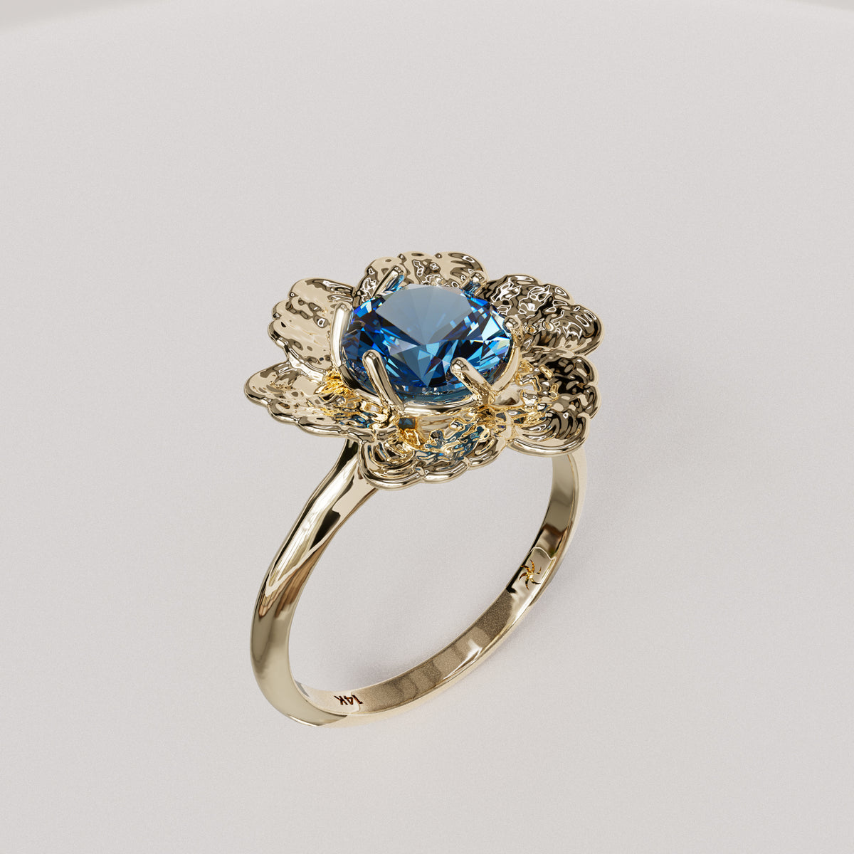 Anemone Engagement Ring with a sapphire center stone, three-quarter view