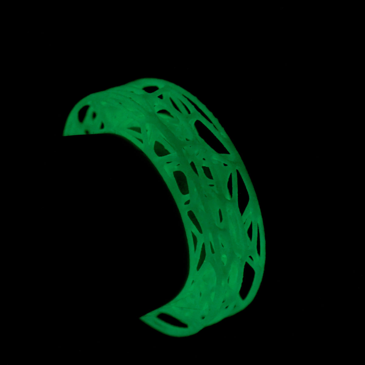 Glow-in-the-Dark Lacuna Bracelet, a glowing green web cuff, by Baroque++