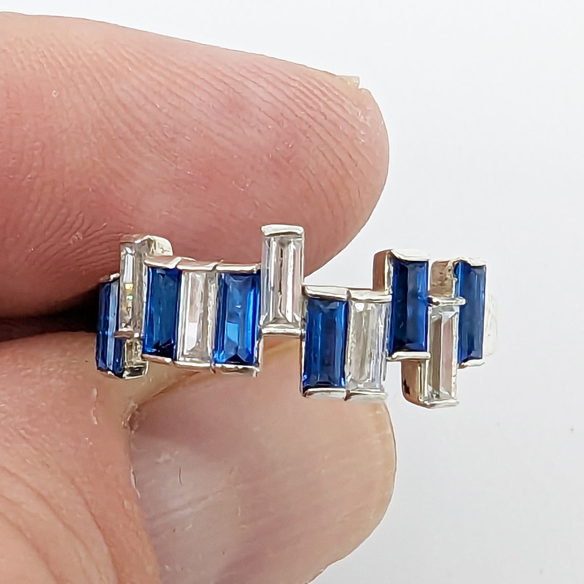 Jitter Baguette Ring worn on the hand
