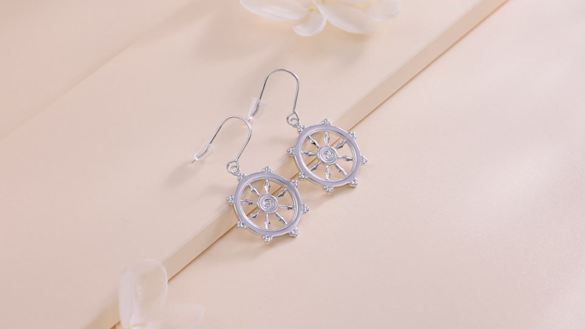 a video of the sterling silver dharma wheel earrings