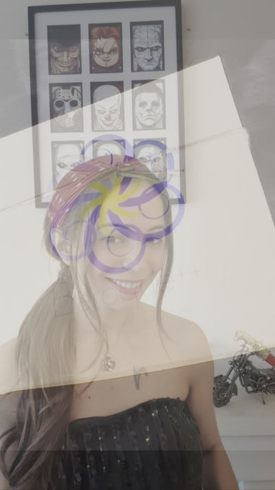 video of a girl in a tube top modeling earrings