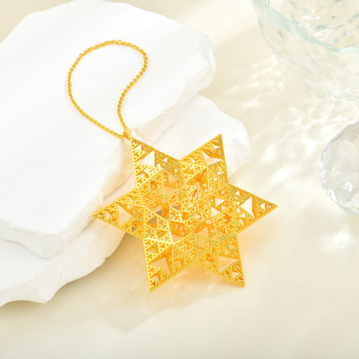 Gold Sierpinski Star of David ornament in a holiday scene