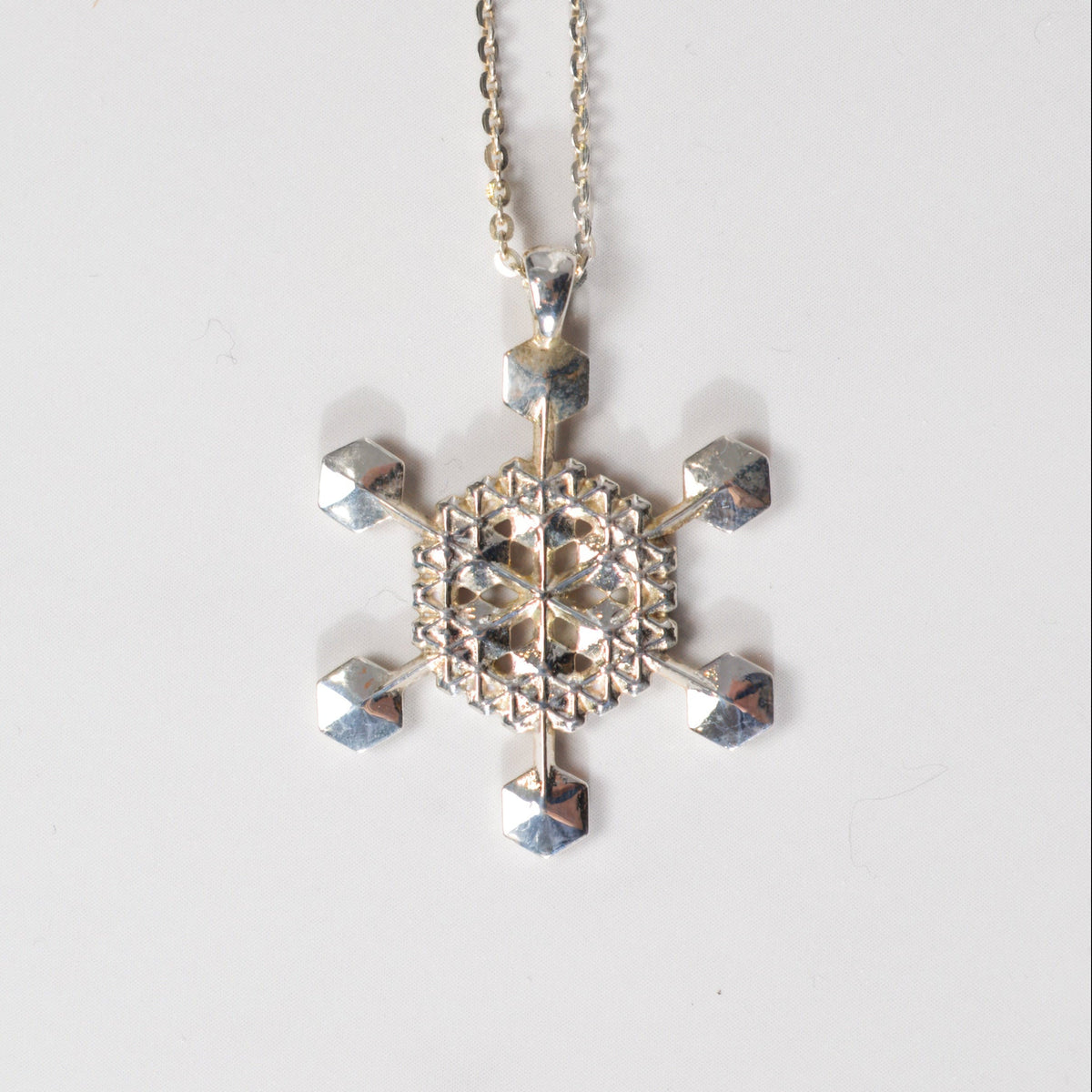 Snowflake Pendant No. 5 in sterling silver, a one-of-a-kind snowflake necklace, by Baroque++